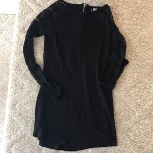 Black form fitting lace sleeved dress